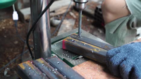 in the woodworkers shop the cnc drill is drilling a letters in to the wooden plank to make a sine, close up footage.