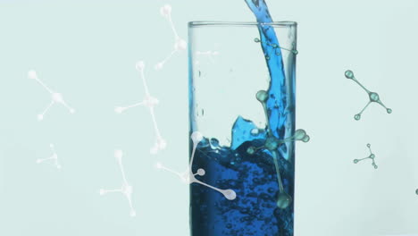 pouring blue liquid into glass, molecular structure animation over it