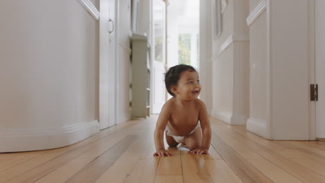 happy baby girl crawling on floor toddler exploring home curious infant having fun enjoying childhood