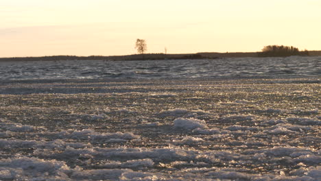 cold sea ice waves, shoreline in finland, concept of global warming