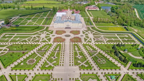Aerial-approaching-shot-of-historic-Rundale-Palace-Castle-in-Latvia-with-gigantic-garden
