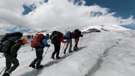 hikers on a glacier