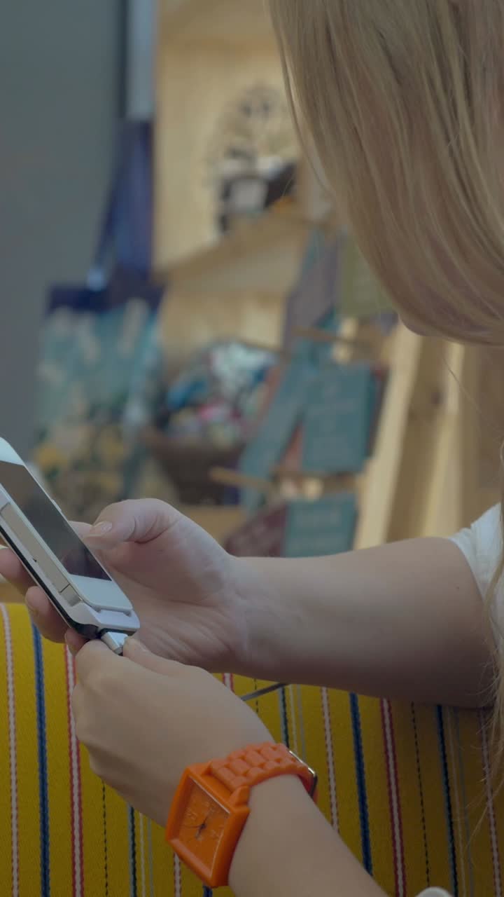 Woman charging her phone
