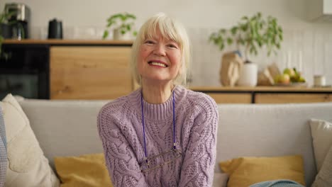 smiling senior woman on a couch