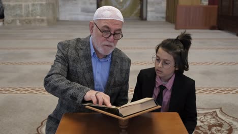 Grandfather-and-grandson-learning-to-pray