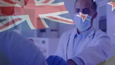Animation-of-flag-of-australia-over-male-doctor-in-face-mask-giving-covid-vaccination-to-patient