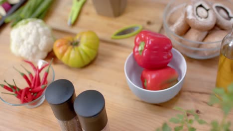 close up of vegetables, mushrooms and spices in kitchen, slow motion