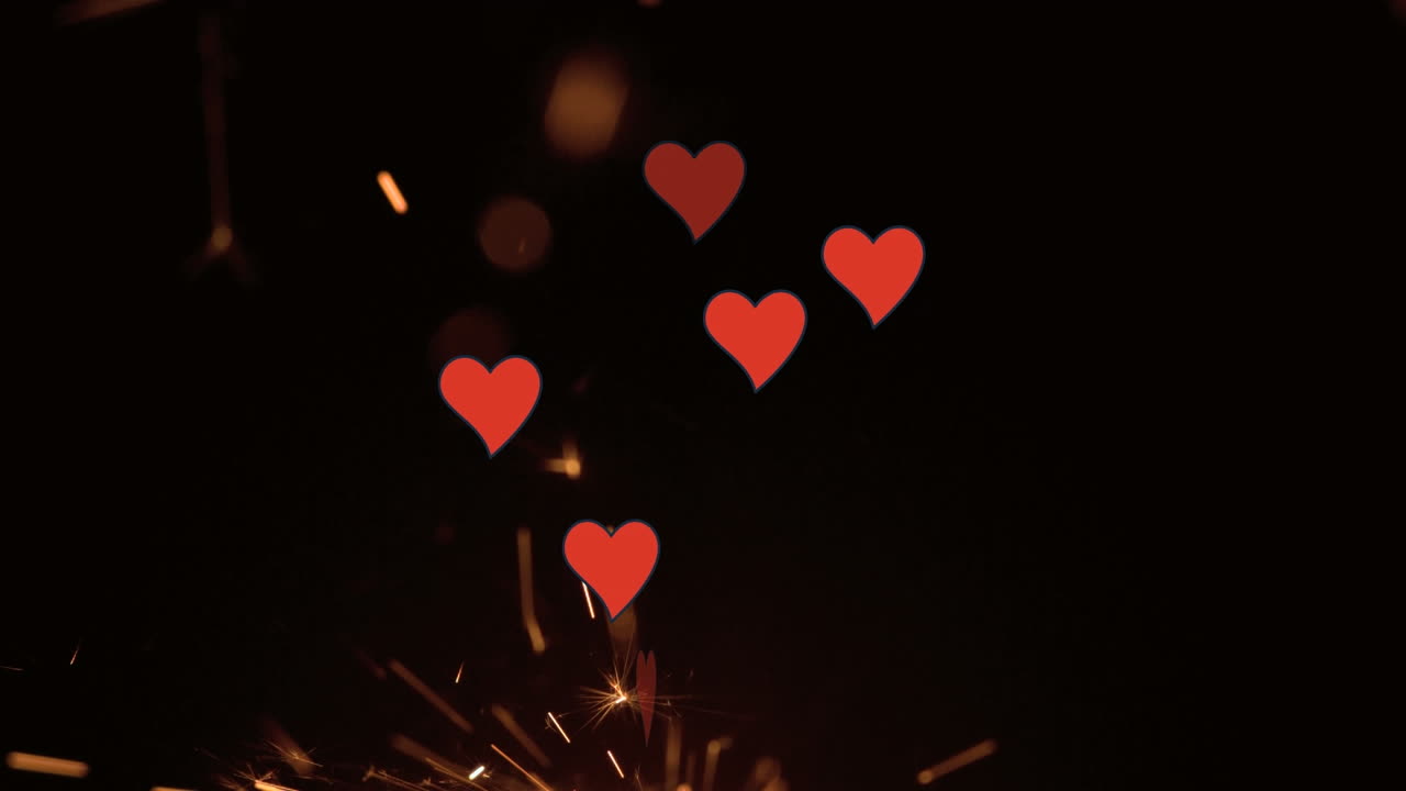 animación de corazones cayendo sobre fuegos artificiales sobre fondo negro