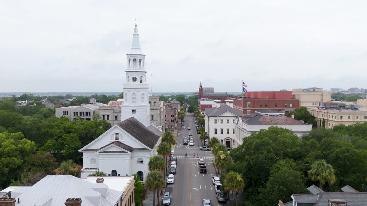 Static drone shot of Charleston's St Michael's Church and Broad Street