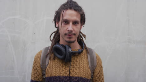 portrait young mixed race man student looking serious handsome guy dreadlocks hairstyle individuality