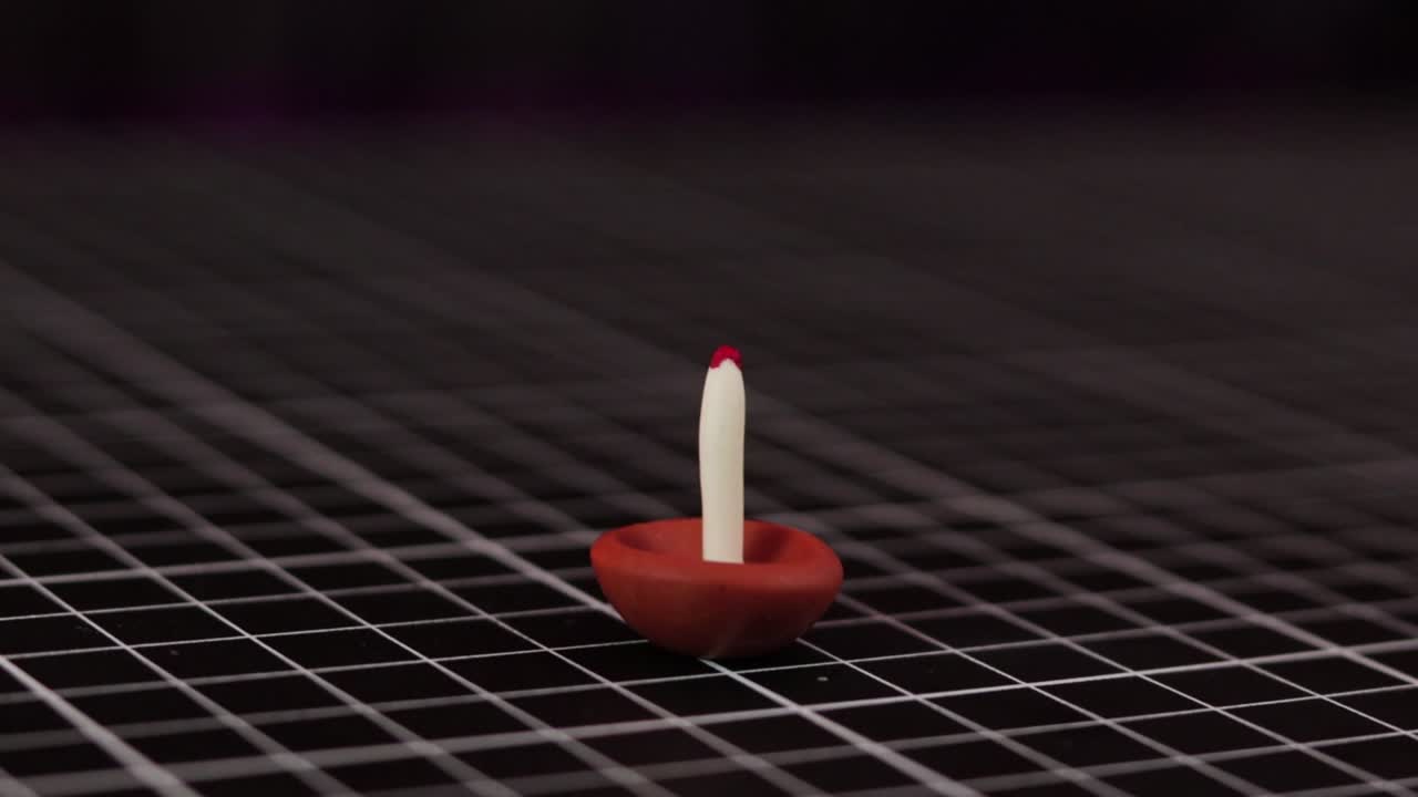 Mini candle made of cold porcelain clay.