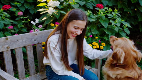 teen girl and golden retriever in a garden