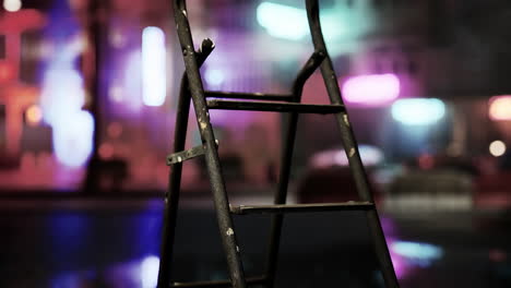 old rusty ladder in the city at night