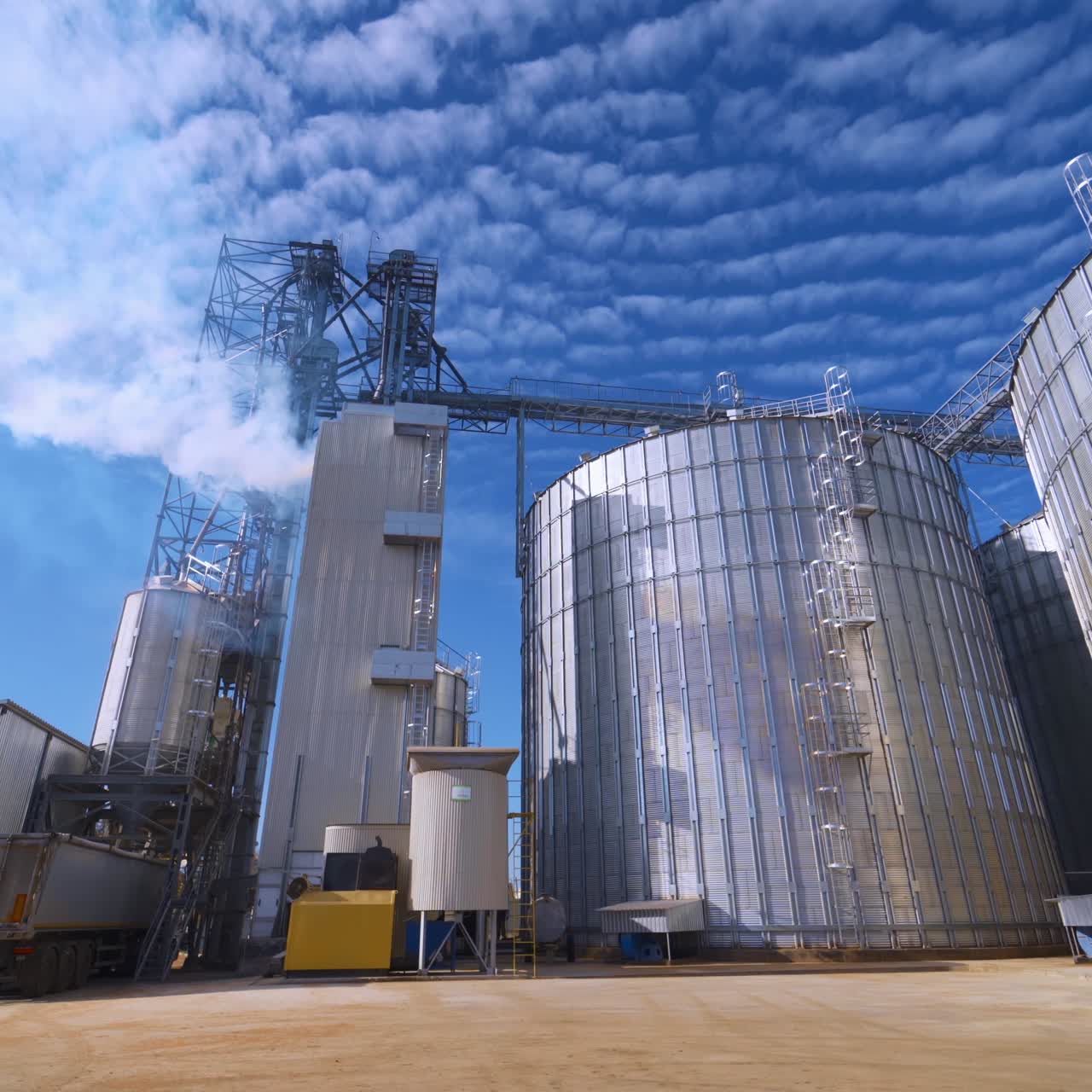 Large Grain Bins. Modern Granary elevator. Agribusiness