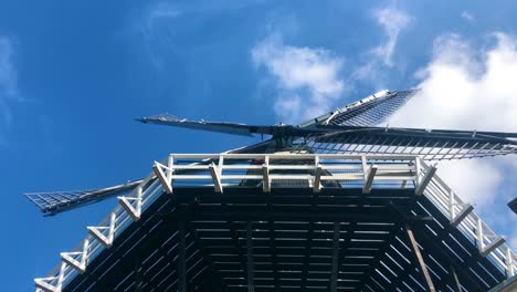 The-sails-of-a-Dutch-windmill,-slowly-rotating-|-Haarlem,-Holland-|-HD-at-30-fps