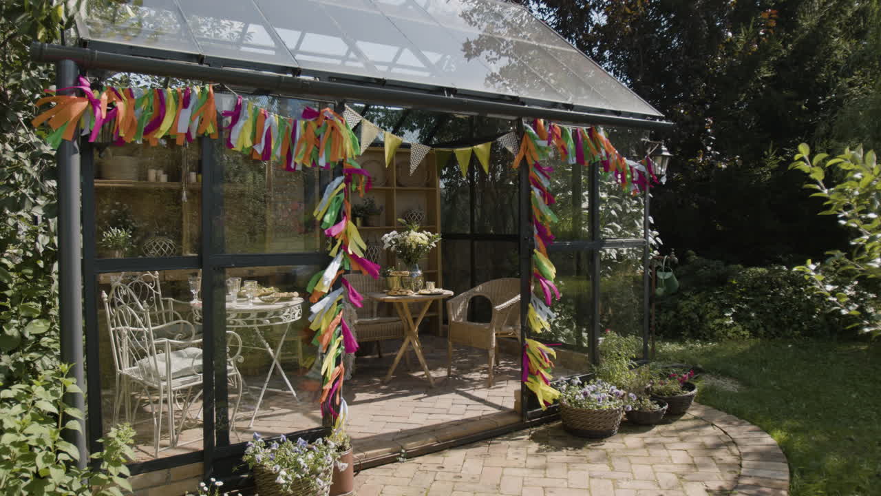 Decorated Greenhouse Set for an Outdoor Tea Party or Celebration