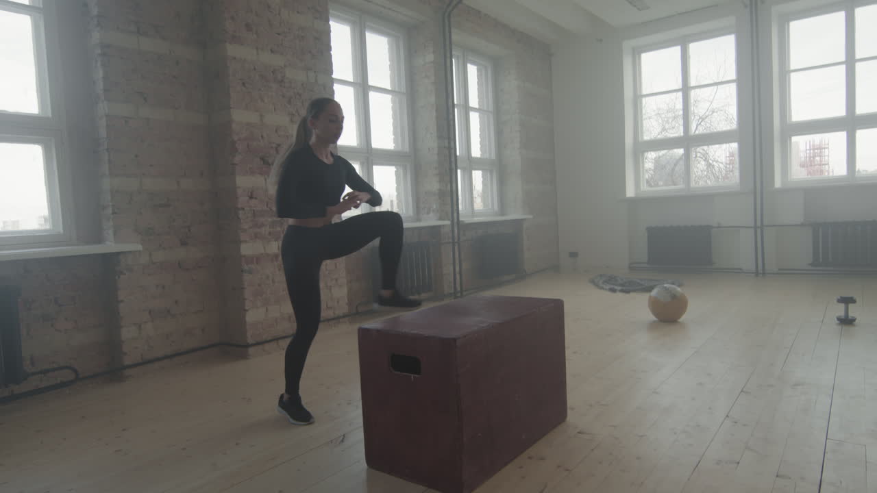 Fit Woman Doing Box Jump