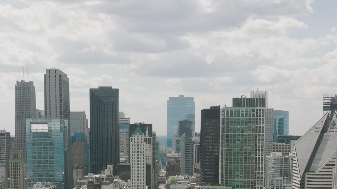 View from above shows cityscape of Chicago with tall buildings