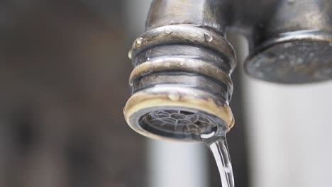 water dripping from a vintage faucet