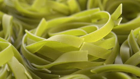 dry green uncooked nest pasta tagliatelle