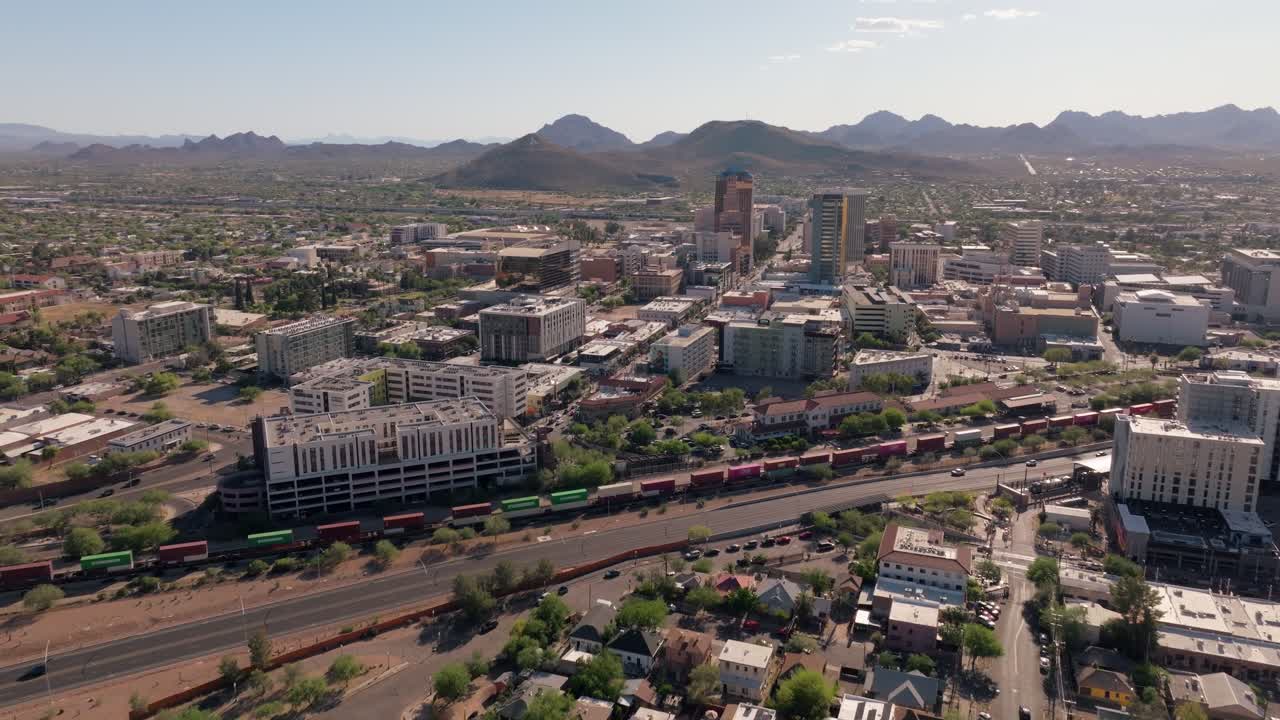 Aerial view of Tucson, Arizona downtown with a train and mountains in the background