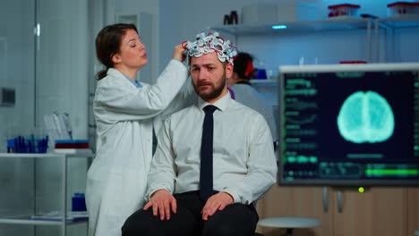 patient with brain scan discussing with researcher neurological doctor