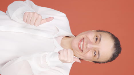 Vertical-video-of-The-woman-making-cute-gestures-for-the-camera.