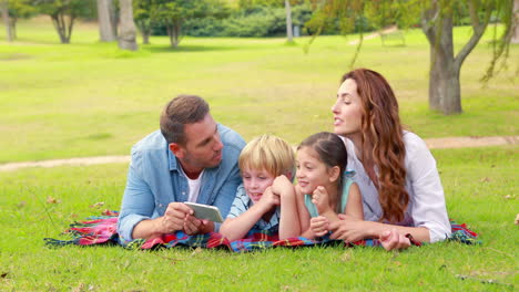 happy family using tablet computer