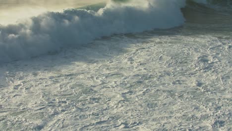 waves rolling by the beach at nazare in europe