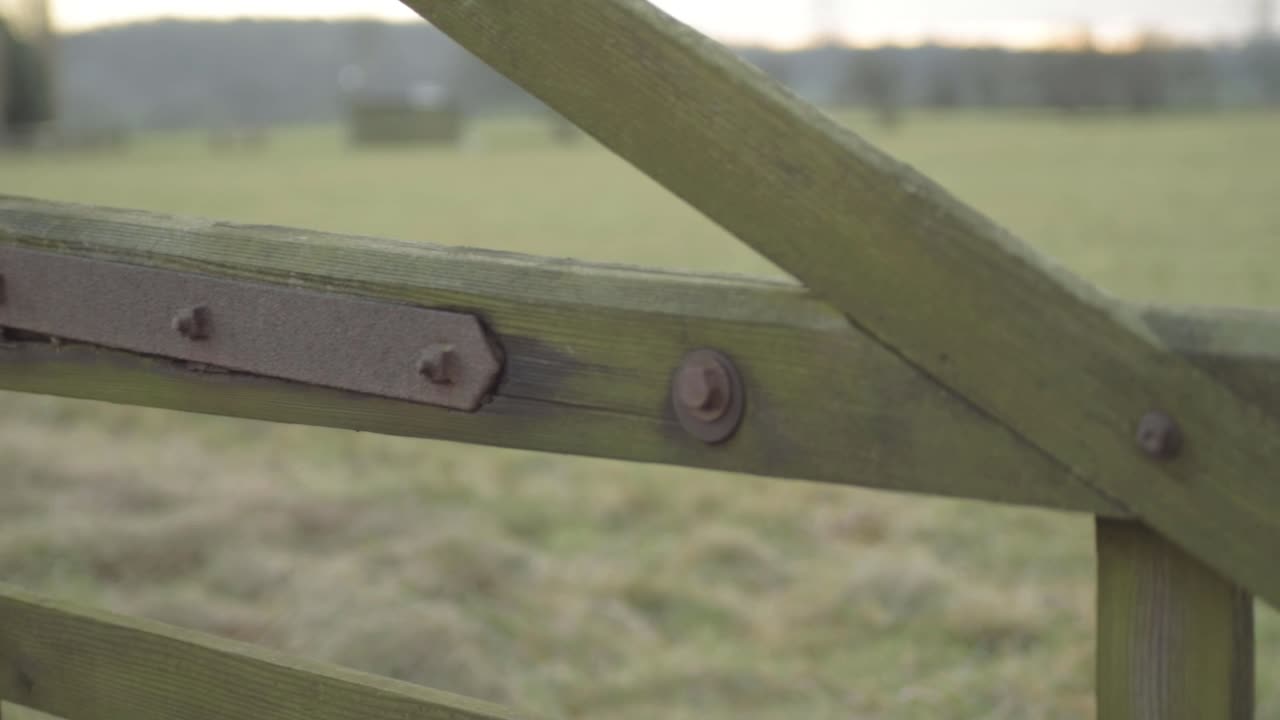 Wooden farmers fence and gate in countryside
