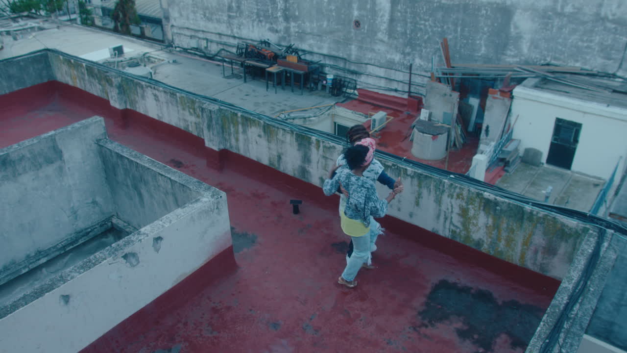 Couple Dancing Tango on a Rooftop in Poor District