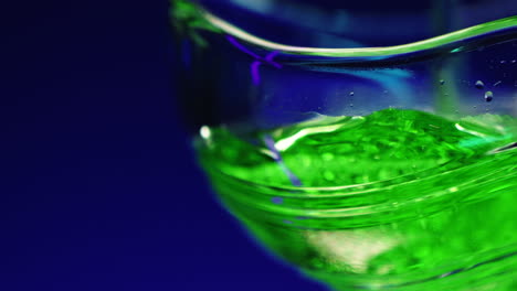 close-up of a vibrant green drink in a glass