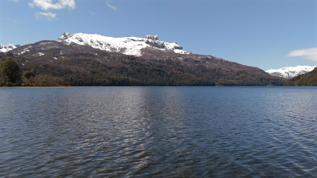 Stunning View of a Snow-Capped Mountain and Serene Lake in Patagonia