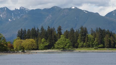 stanley park with mountains behind - vancouver