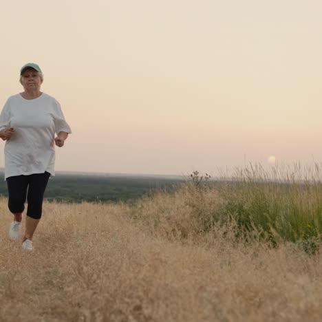 an elderly woman runs along a country road goes in for sports 1