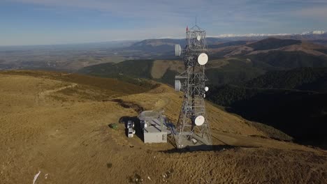 aerial view of a telecommunication tower on a mountaintop