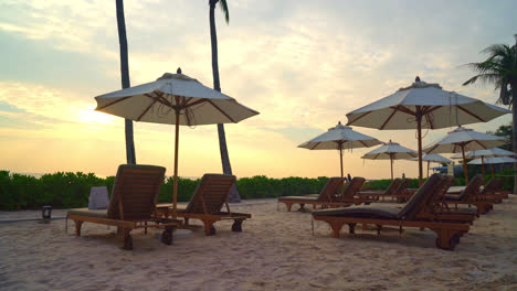 umbrella-with-bed-pool-around-swimming-pool-with-ocean-sea-background---holiday-and-vacation-concept