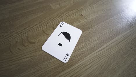 a physical nazi - hitler card being played on the table