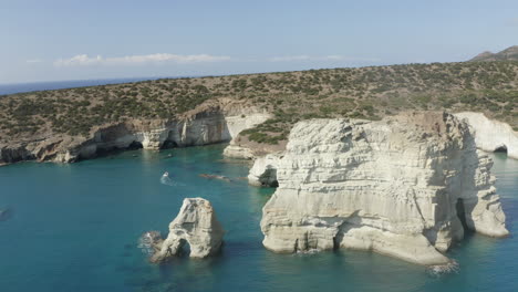 Klefitko-beach-and-white-cliffs-drone-aerial-shot-over-the-blue-waters-and-dramatic-coastline-of-the-greek-island-of-Milos,-Greece-in-4k