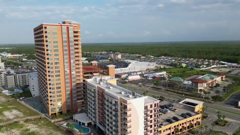 Half-orbit-aerial-footage-of-condos-and-hotels-on-Orange-Beach-in-Gulf-Shores-Alabama