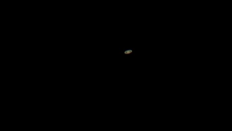 saturn with rings as seen through small backyard telescope