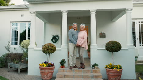 New-home,-senior-couple-love-and-smile-for-house