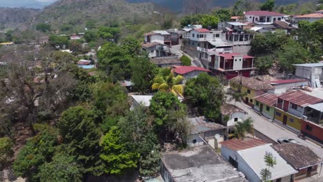 low flight over quaint streets and home rooftops of copan in honduras