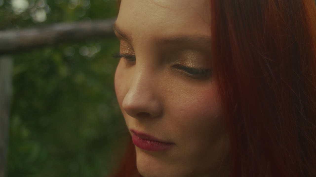 Woman with red hair in profile view
