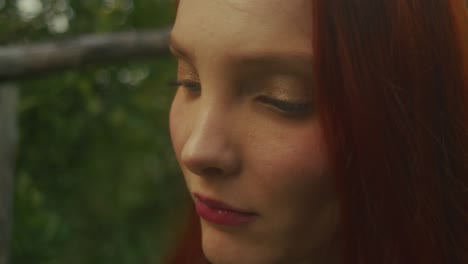 woman with red hair in profile view