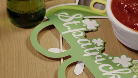 Close-Up-Of-Irish-Novelties-And-Props-With-Snacks-Of-Tortilla-Chips-And-Salsa-At-St-Patrick's-Day-Party-1