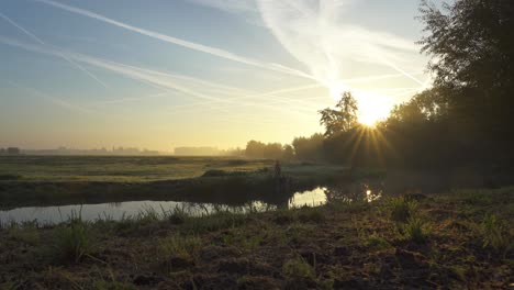 sunrise over a misty dutch countryside