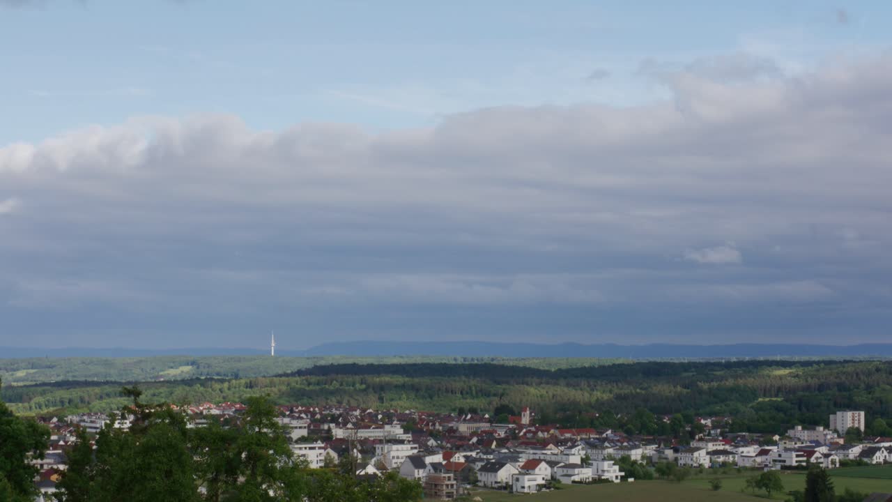 Timelapse of clouds above rural town in Stuttgart Germany at noon, Baden Wurttemberg, Balvaria Europe