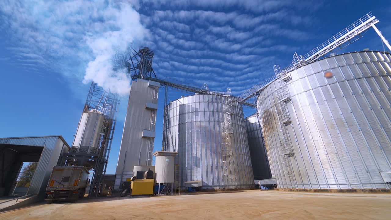 Large Grain Bins. Modern Granary elevator. Agribusiness.