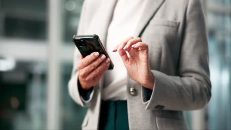 woman using smartphone in office